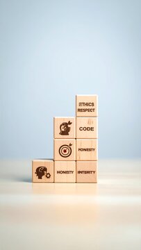 Wooden blocks stacked in a pyramid shape with ethical values
