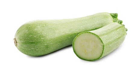 Fresh whole and cut zucchinis isolated on white