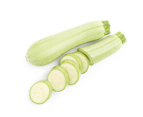 Fresh whole and cut zucchinis isolated on white, top view