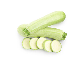 Fresh whole and cut zucchinis isolated on white, top view