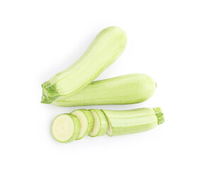 Fresh whole and cut zucchinis isolated on white, top view