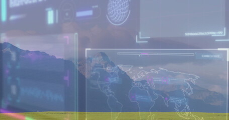Scanning translucent world map interface over grassland at mountain foot, with circular globe