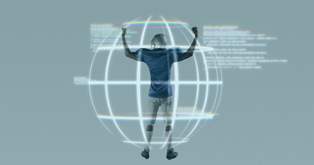 Leaping football player grasping wireframe globe in studio, wearing helmet, jersey and cleats