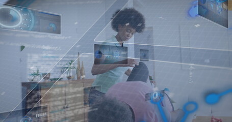 Therapist wearing scrubs manipulating patient's knee on therapy table at home, digital overlays