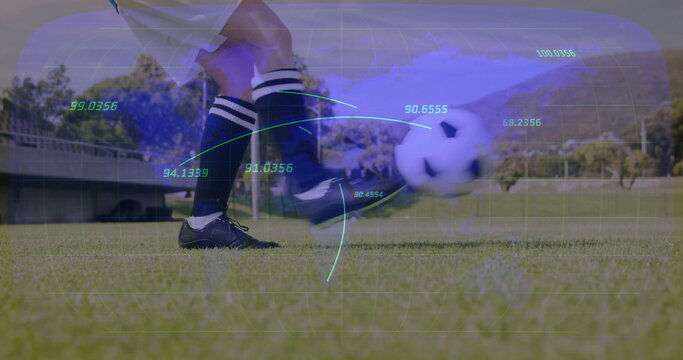 Kicking female soccer player in navy cleats sending blurred ball across pitch, with metrics overlay