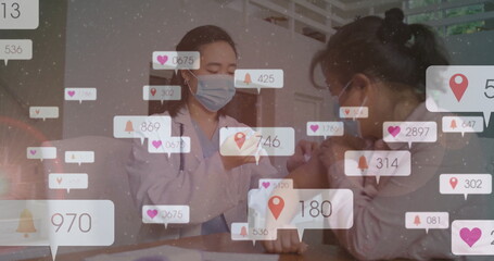 Administering doctor in mask vaccinating patient arm in clinic with syringe and notification icons