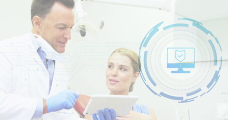 Dentist in coat explaining data in dental clinic using tablet and interface graphic, copy space