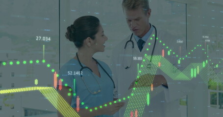Nurse in blue scrubs and doctor in white coat analyzing tablet in clinic, with chart overlays