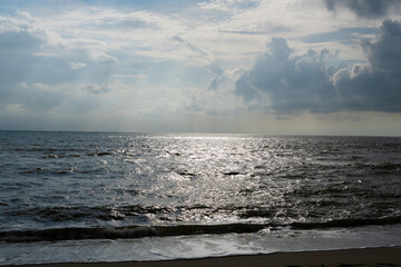 Powerful waves crash on the coast under a dramatic sky and Storm clouds gathering over the ocean waves near the coast in morning