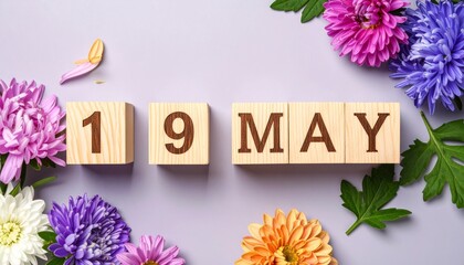 Wooden Blocks with Date 19 May. Floral Calendar – Vibrant Flowers on Solid Colored Background
