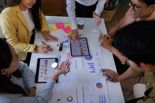 Corporate accountant Asian team use accounting software on laptop to calculate and maximize tax refund and improve financial performance base on financial data, business accounting . 
