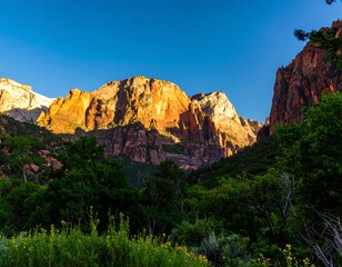 Obraz premium Sunrise over a canyon with colorful rock formations