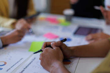 Asian Business financial Team, accountant discussing with partner are meeting to audit finance planning sales to meet targets set in next year. stock market concept..
