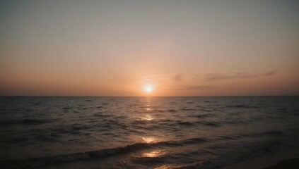 Sunset over calm sea at beach