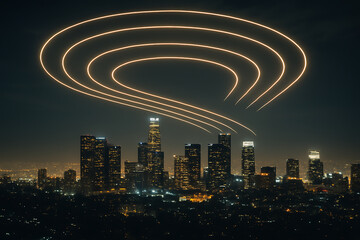 Neon Light Trails Above Los Angeles Cityscape at Night