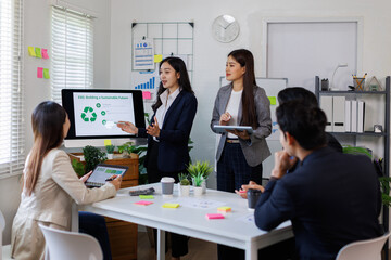 Team of asian business ESG environmental social governance policy for modish business to set a standard to achieve high ESG score
