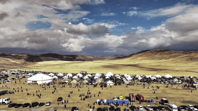 Nomadic Festival in Kazakhstan with Yurts and Cars Parked in the Steppe