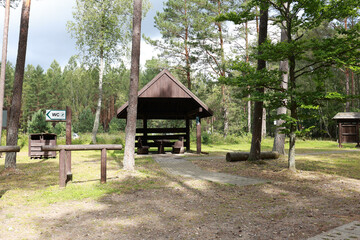 wooden gazebo near the forest, a place for family recreation in nature