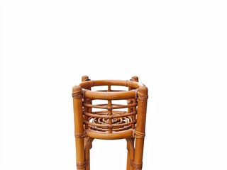 The white background in the picture is a brown rattan woven pot with a beautiful pattern. It has a circular shape and floral patterns. It is used to place potted plants or as a decoration in the house