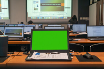 Obraz na płótnie Canvas Empty Computer Lab with Green Screen Monitor