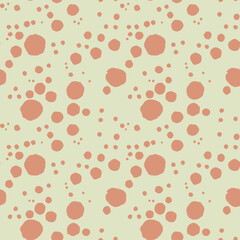 seamless pattern with orange polka on pastel green