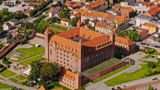 Cinematic aerial shot of Gniew Castle landmark fortress and Polish heritage site