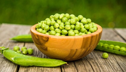 Fresh green peas in a wooden bowl on a rustic wooden table, highlighting healthy produce.
