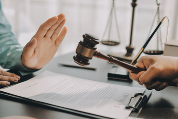 Lawyer explained to the client about the law that must be brought against the court case.