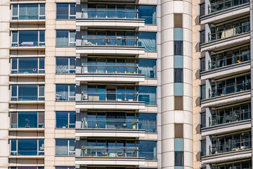 Fototapeta premium modern apartment building with balconies and laundry drying in Shanghai, China