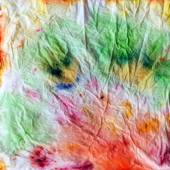 Obraz premium This vibrant, abstract, tie-dye drip art on paper showcases unique watercolor symmetry and textures. Perfect for use as a background, modern art design, and creative decoration.