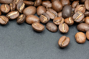 Top view of Roasted coffee beans in dark background