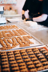 Small homemade baked cookies on a board, charity handmade treats closeup.