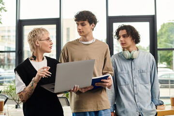 Young professionals collaborating in a modern office workspace focused on achieving goals