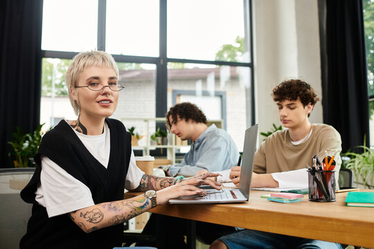 Creative youth engaged in collaborative work at a modern office space during daytime hours