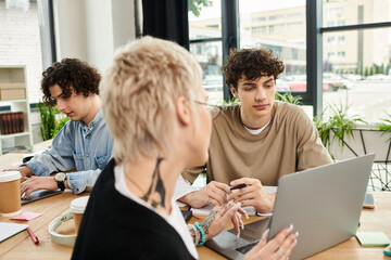 Engaged youth collaborating in a vibrant office setting on important projects
