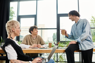 Engaging in collaborative discussions among youthful professionals in a modern office setting
