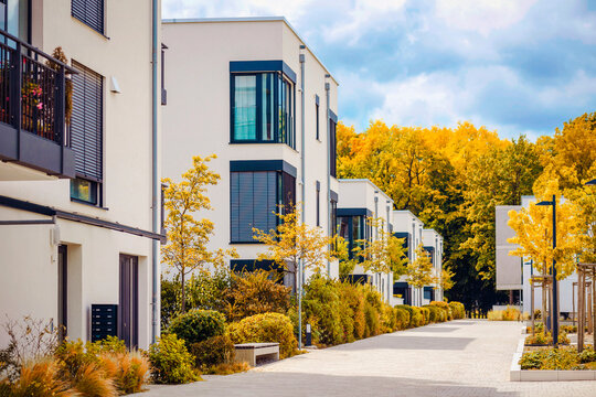 Autumn Landscape of Residential Apartment Building. Modern Facade Building on Fall Autumn Background. 