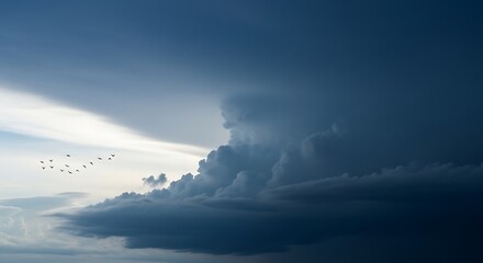 Dramatic storm clouds with birds in flight.