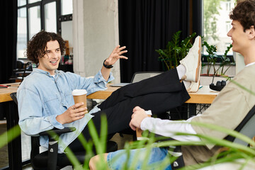 Engaging conversation between young professionals in a modern office setting