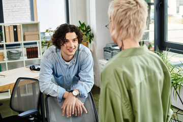 Engaging conversation between youth in a modern office workspace during the workday