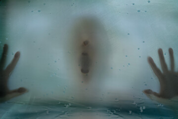 Ghostly terrifying visage behind foggy glass, nightmare imagery, expression fear, memory, Mystery image unknown person behind streaked translucent barrier, Psychological distress