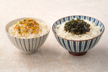 A bowl of white rice topped with rice seasonings.