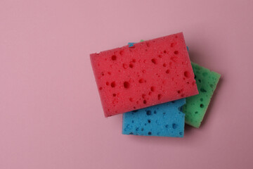 cleaning sponges on a pink background
