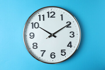wall clock on a green background
