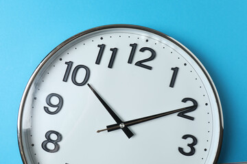 wall clock on a green background
