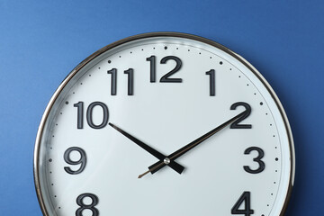 wall clock on a green background
