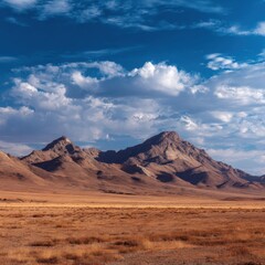 Vast Desert Landscape Under Dramatic Sky with Majestic Mountains and Fluffy Clouds Creating a Serene Outdoor Scene