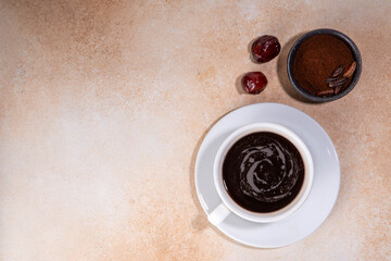 Black coffee cup, made with grated date seeds