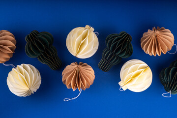 Christmas composition with traditional Scandinavian paper honeycomb ornaments