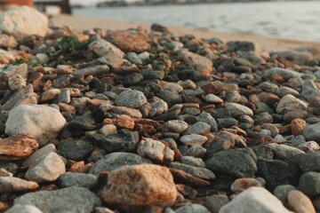 Close-up view of a collection of varied-colored stones on a beach